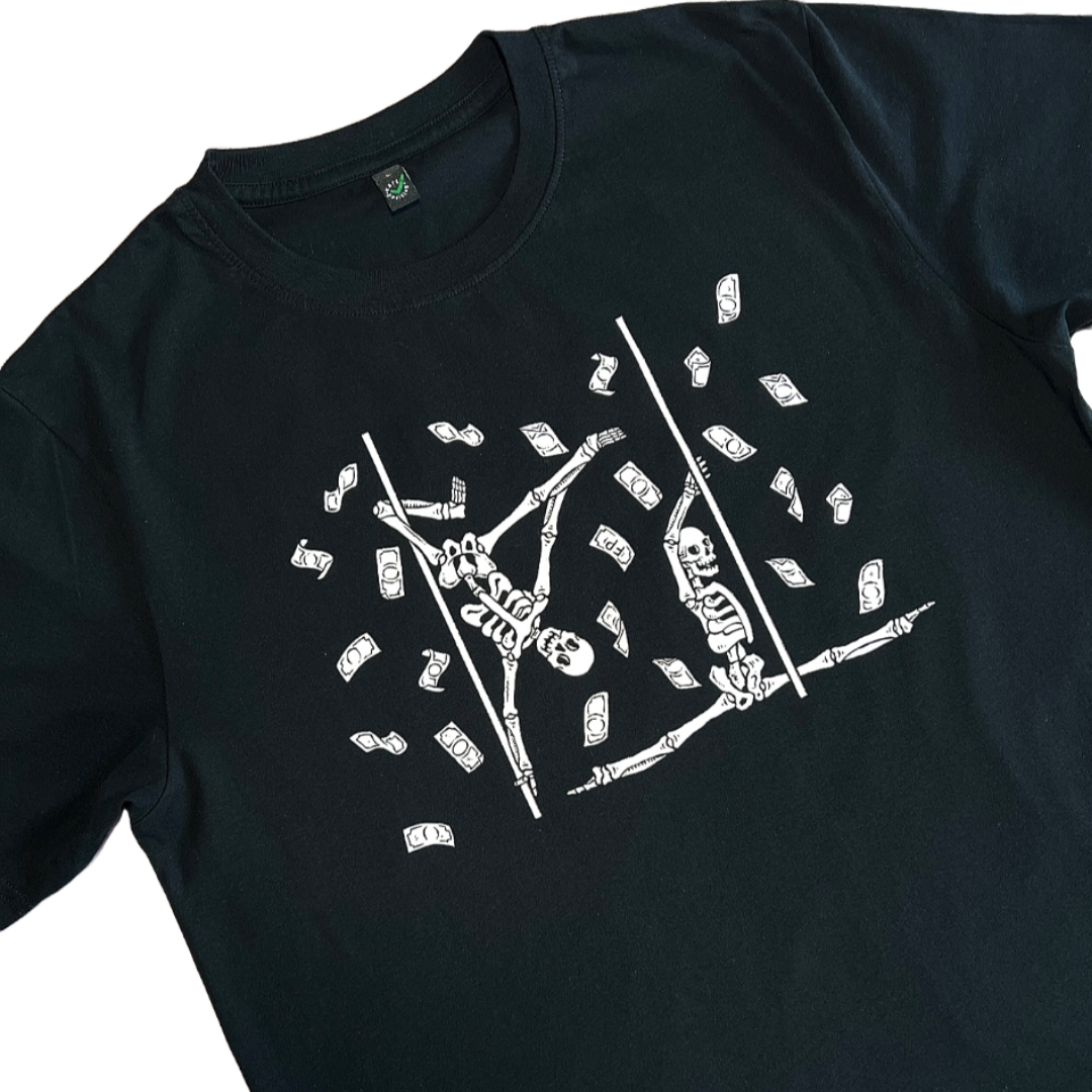 closeup of a black unisex t-shirt with pole dancing skeletons