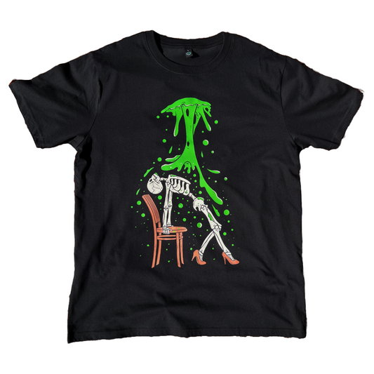 black unisex t-shirt of a skeleton wearing high heels posing in a chair with toxic waste falling on them